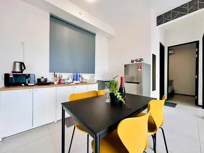 a kitchen with a black table and yellow chairs at Classic House in Georgetown 3BR 10pax in George Town