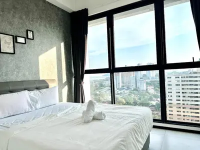 a bedroom with a bed with a teddy bear on it at Groups & Families Spacious Infinity Pool 3br 10pax in George Town