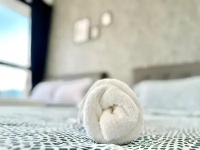 a towel on a table in a bedroom at Groups & Families Spacious Infinity Pool 3br 10pax in George Town
