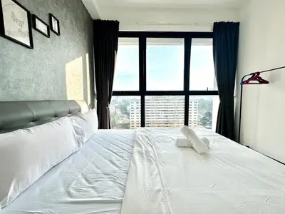 a bedroom with a white bed with a large window at Groups & Families Spacious Infinity Pool 3br 10pax in George Town