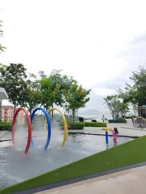 two children are playing in a water park at World Class Apartment In Georgetown 3BR 10 pax in George Town