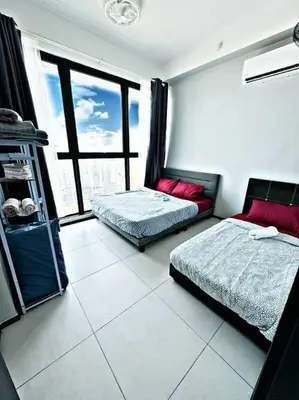 a bedroom with two beds and a large window at World Class Apartment In Georgetown 3BR 10 pax in George Town