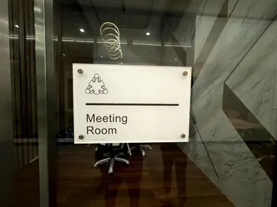 a sign in a glass door of a meeting room at Infinity pool luxury apartment suites 3br 10 pax in George Town
