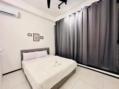 a bedroom with a bed with black curtains at UB suite aparment for food hunter 3br 10 pax in George Town