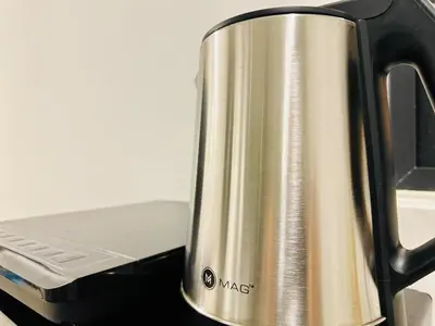 a coffee pot sitting on top of a stove at UB suite aparment for food hunter 3br 10 pax in George Town