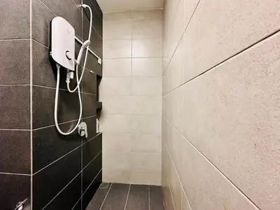 a bathroom with a shower with a phone on the wall at UB suite aparment for food hunter 3br 10 pax in George Town