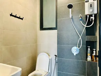 a bathroom with a shower with a toilet and a sink at Near komtar apartment in goergetown 3br 10 pax in George Town