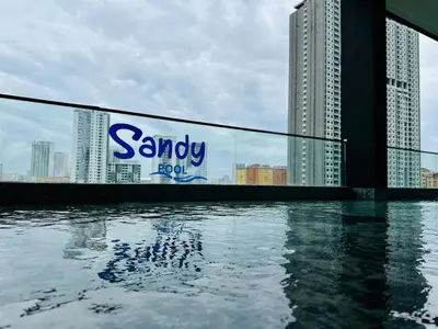 a sign on the side of a building next to water at Rooftop Penang View & infinity pool suite apartment 3br 10 pax in George Town