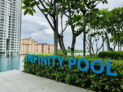 a sign for mercury pool in front of a city at Rooftop Penang View & infinity pool suite apartment 3br 10 pax in George Town