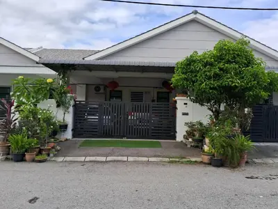 a house with a gate and trees in a driveway at HEE & PENNIE House in Ipoh