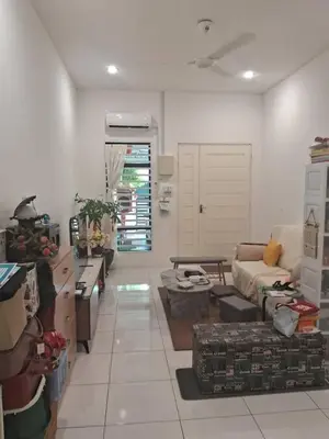 a living room filled with lots of boxes and a couch at HEE & PENNIE House in Ipoh