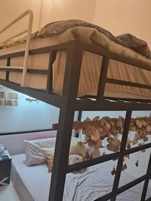 a bunk bed with a bunch of stuffed animals on it at HEE & PENNIE House in Ipoh