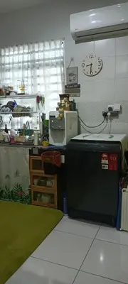 a kitchen with a counter and a clock on the wall at HEE & PENNIE House in Ipoh