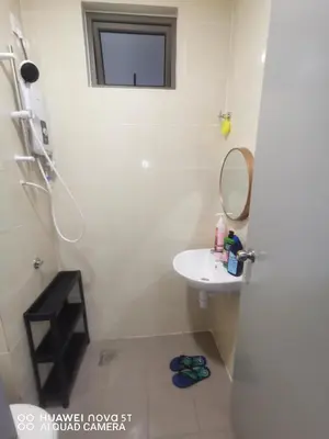 a white bathroom with a sink and a mirror at Belladira Homestay CH in Brinchang