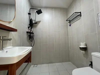 a bathroom with a sink and a toilet at Hillview Ipoh in Ipoh