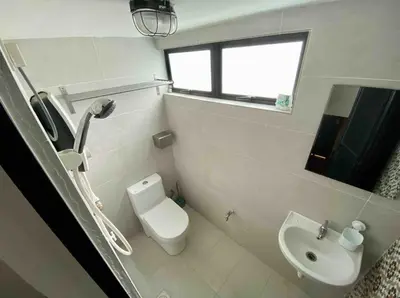a white bathroom with a toilet and a sink at Ipoh Garden Canning Very Near Food Desire Homestay in Ipoh