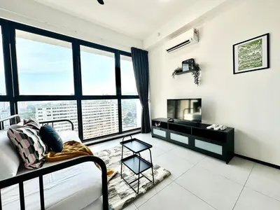 a living room with a bed and a large window at Urban Rooftop veiw PENANG 3br 10 pax in Jelutong