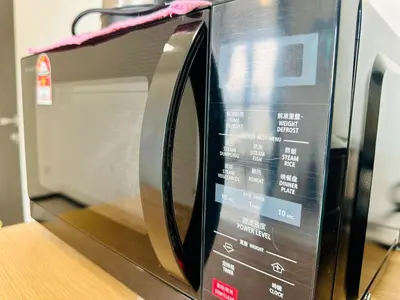 a microwave oven with its door open on a counter at Urban Rooftop veiw PENANG 3br 10 pax in Jelutong