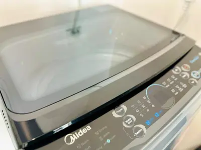 a close up of a toaster oven with the door open at luxury familystay 3br 10 pax in Jelutong