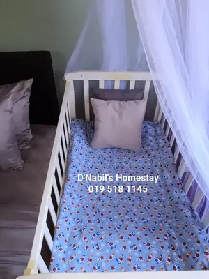 a bunk bed with a crib with a canopy at D Nabils Homestay Musslim Sahaja in Kulim