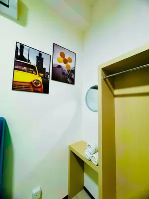 a room with two pictures of a car on the wall at Stunning Luxury Breathtaking Sea & City Views 3BR 12PAX in Jelutong