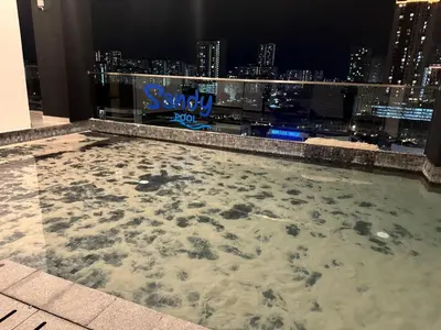 a large swimming pool on the roof of a building at Cozy with Sea & City Views 3BR 12PAX in Jelutong