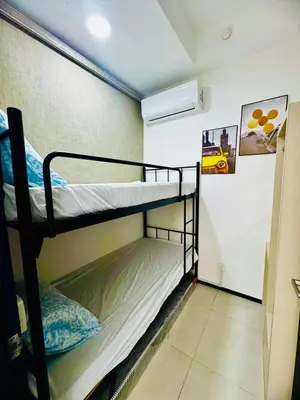 a room with two bunk beds in a room at Cozy with Sea & City Views 3BR 12PAX in Jelutong