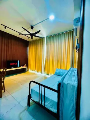 a bedroom with a bed in a room at Luxury Suites with Sea & City Views 3BR 12PAX in Jelutong
