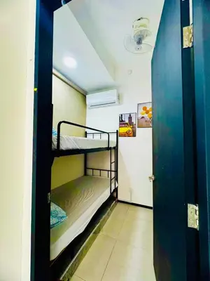 a hallway with two bunk beds in a room at Luxury Suites with Sea & City Views 3BR 12PAX in Jelutong