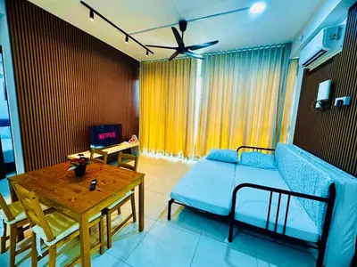 a living room with a couch and a table at Luxury Suites with Sea & City Views 3BR 12PAX in Jelutong