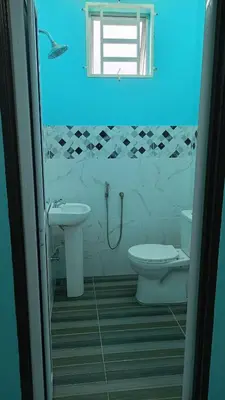 a bathroom with a toilet and a sink and a window at Homestay RestUI, Kepala Batas Penang, 4km dari Tol Bertam in Kepala Batas