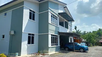 a blue car parked in front of a house at Homestay RestUI, Kepala Batas Penang, 4km dari Tol Bertam in Kepala Batas