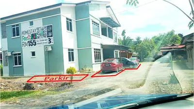 a car is parked in front of a building at Homestay RestUI, Kepala Batas Penang, 4km dari Tol Bertam in Kepala Batas