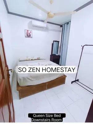 a bedroom with a bed in a room at So Zen Homestay in Taiping