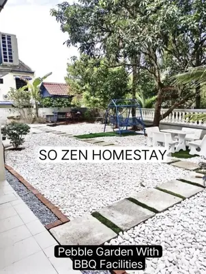 a backyard with a playground with a swing at So Zen Homestay in Taiping