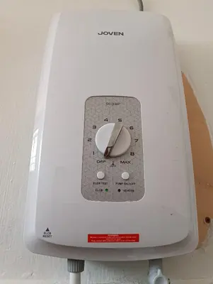 a close up of a white sewing machine at Luxurious Noble Homestay in Sungai Petani