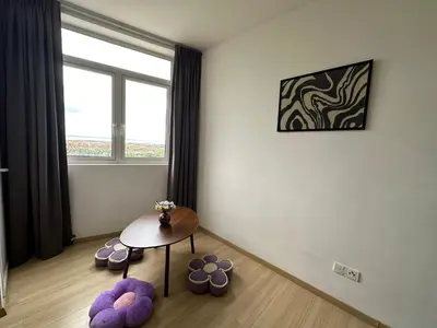 a room with a table and some purple cushioned chairs at Joyful Seaview Studio 118 Island88 for 3pax in George Town