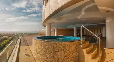 a swimming pool on the balcony of a building at Joyful Seaview Studio 118 Island88 for 3pax in George Town