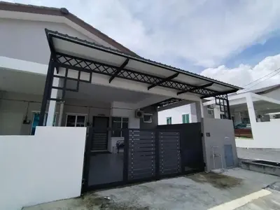a detached garage with a black metal roof at FDhomestay in Kampung Baharu Batu Dua