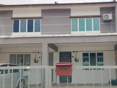 a house with a red mailbox in front of it at Lilly Grove Homestay in Kampong Ayer Melintas Besar