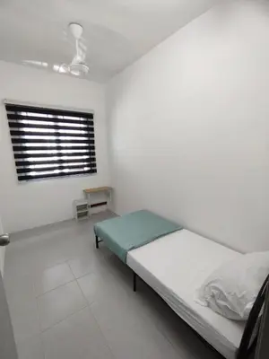 a white room with a bed and a window at Lilly Grove Homestay in Kampong Ayer Melintas Besar