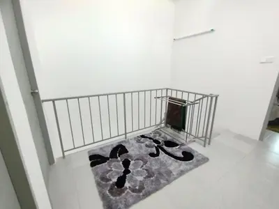 a white room with a rug on the floor at Lilly Grove Homestay in Kampong Ayer Melintas Besar