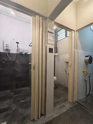 a bathroom with a shower and a toilet at Wayton Cottage in George Town