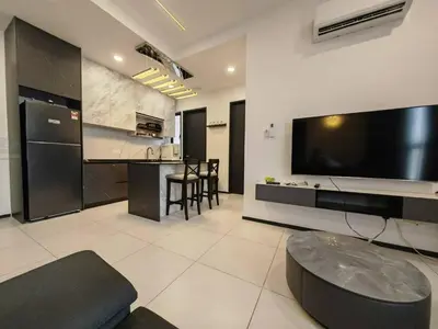 a living room with a large flat screen tv at Penang Urban Homestay in Jelutong
