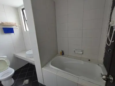 a white bathroom with a tub and a toilet at 3B2BR Marina Height Family Room Sea View Room in Lumut