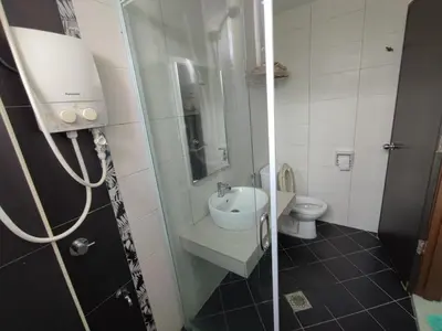 a small bathroom with a sink and a toilet at 3B2BR Marina Height Family Room Sea View Room in Lumut