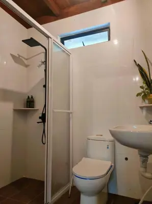a bathroom with a toilet and a sink at The HIJAU Camp & Cabin in Gopeng