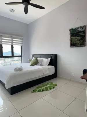 a bedroom with a bed with a ceiling fan at The Horizon - Ipoh' Rachel in Ipoh