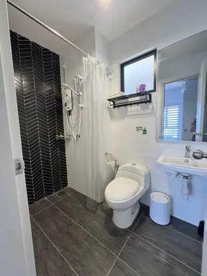 a bathroom with a toilet and a sink and a shower at The Horizon - Ipoh' Rachel in Ipoh