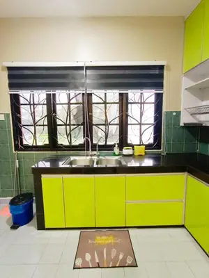 a kitchen with a sink and a window at D'Cozy Homestay in Seri Manjung